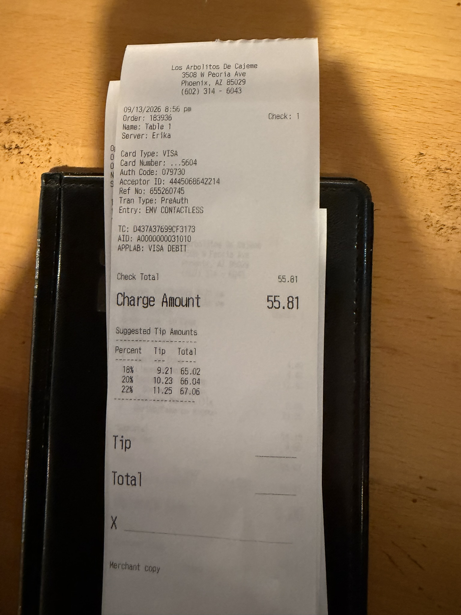 Receipt from Los Arbolitos de Cajeme showing check total of $55.81 with server Erika credited